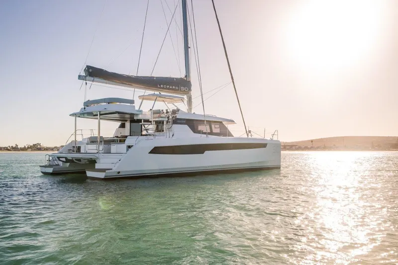 Slide: The Image of Leopard 50 catamaran 2020 on calm waters at sunset. - 8