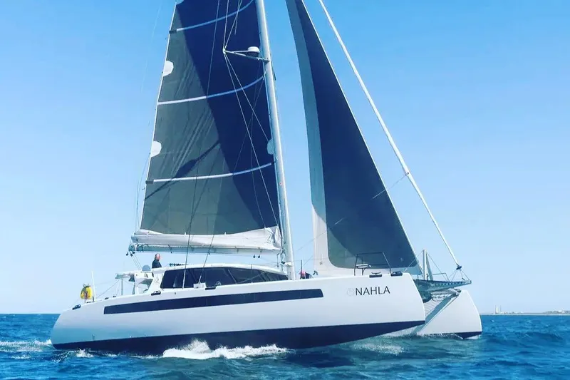 The Image of Sailing catamaran Balance 526, 2022 model, cruising on open sea under clear blue sky. - 0