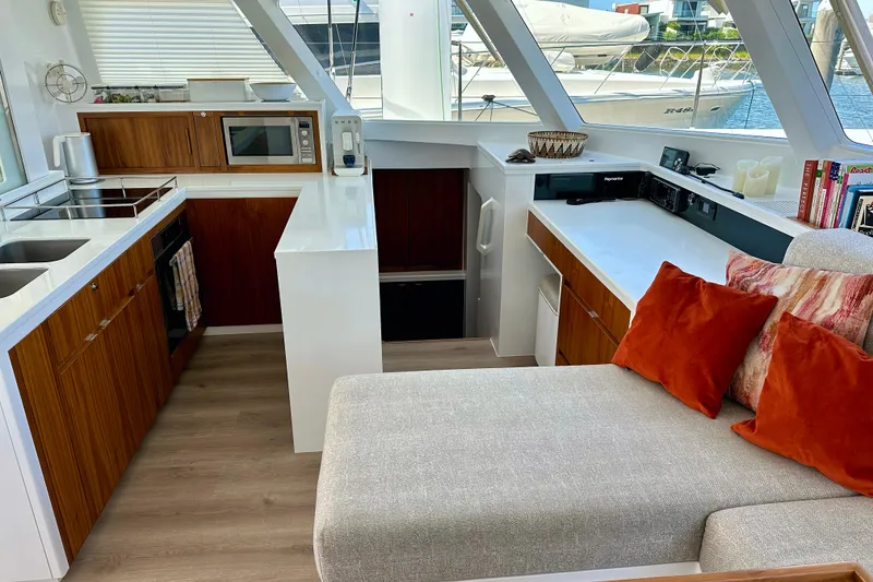 Slide: The Image of Modern yacht interior with kitchen, lounge area, and large windows; Balance 526, 2022 model. - 10