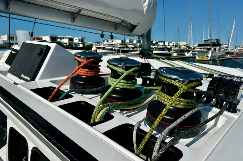 Slide: The Image of Sailing yacht deck with colorful ropes and winches, Balance 526, 2022 model, in marina. - 22