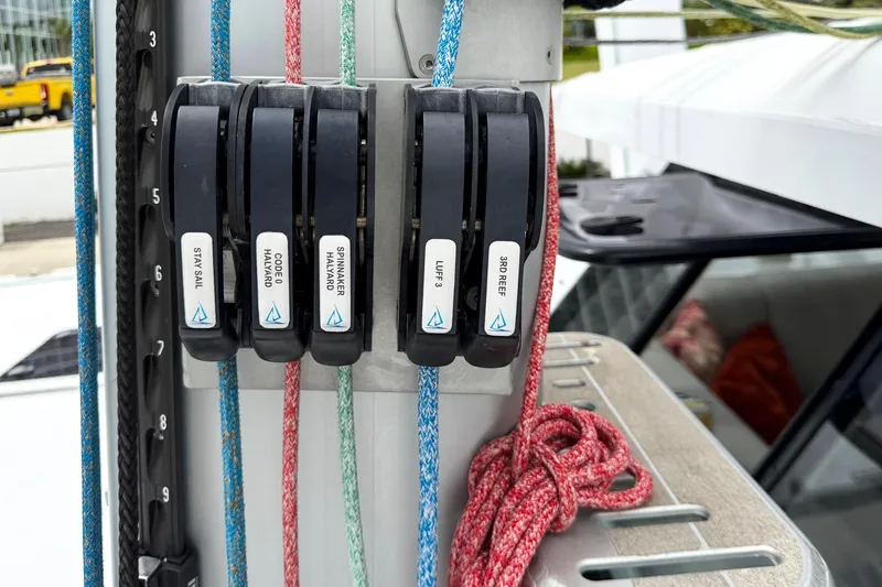 Slide: The Image of Sailing rigging system on Balance 526 yacht, featuring labeled halyards and ropes. - 23