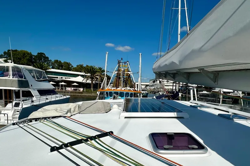 Slide: The Image of Sailboat docked at marina with solar panel, Balance 526 model, 2022. - 27