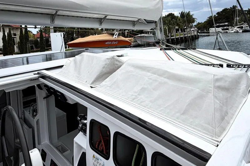 Slide: The Image of Sailboat Balance 526 (2022) with solar panels docked at marina. - 28