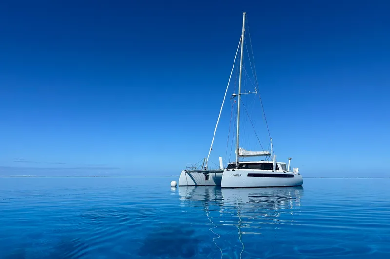 Slide: The Image of Sailboat Balance 526, 2022 model, anchored on calm blue ocean under clear sky. - 3