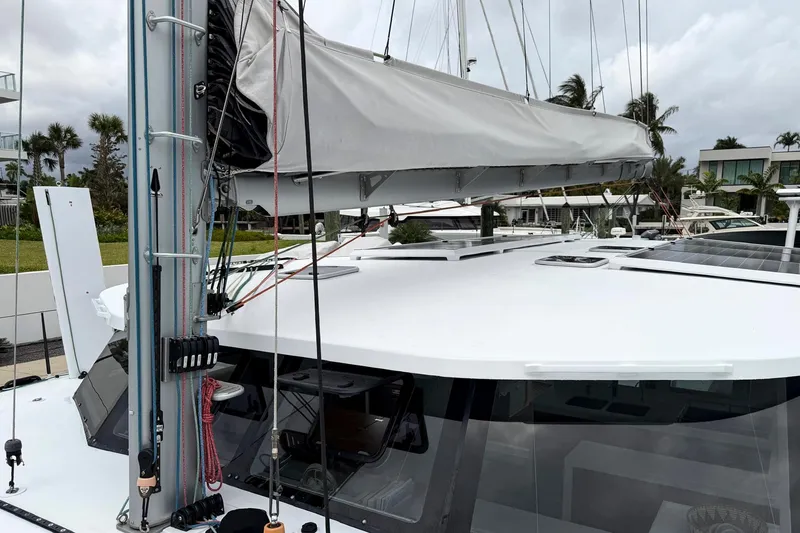 Slide: The Image of Sailboat Balance 526 (2022) with covered sail and solar panels on deck. - 31