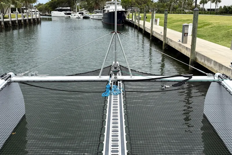 Slide: The Image of Front view of a 2022 Balance 526 catamaran docked in a marina. - 36