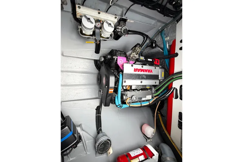 Slide: The Image of Engine compartment of a 2022 Balance 526 boat with Yanmar engine and safety equipment. - 40
