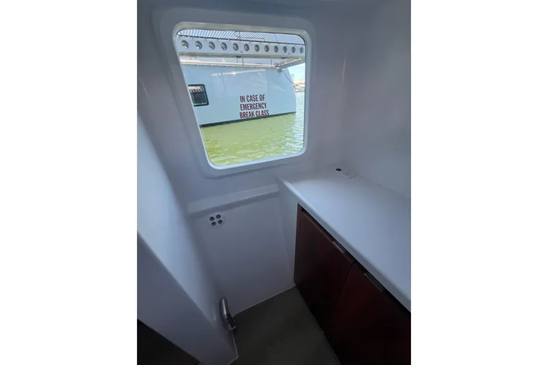 Slide: The Image of Interior view of Balance 526 yacht, 2022, showing emergency window and cabinetry. - 45