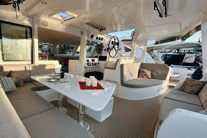 Slide: The Image of Luxurious 2022 Balance 526 yacht interior with elegant seating and dining area. - 6