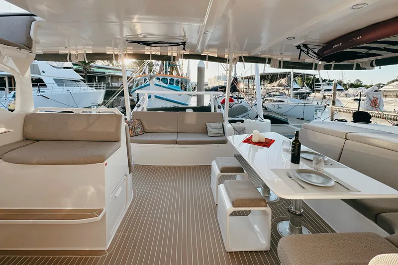 Slide: The Image of Luxurious 2022 Balance 526 yacht interior with elegant seating and dining area at marina. - 8
