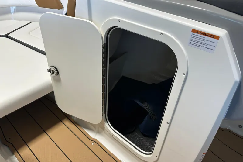 Slide: The Image of Storage compartment in Chaparral 23 SSi boat, year 2026. - 11