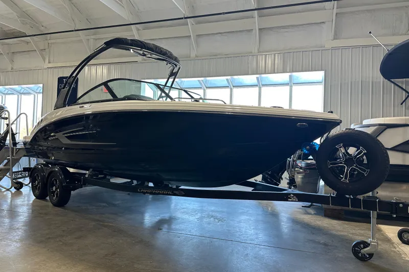 The Image of 2026 Chaparral 23 SSi boat on trailer in warehouse. - 2