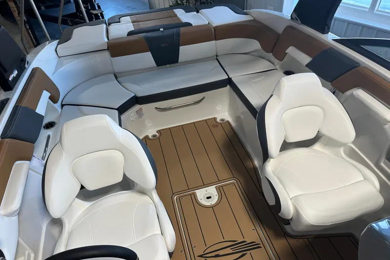 Slide: The Image of Interior of 2026 Chaparral 23 SSi with luxurious white seating. - 6