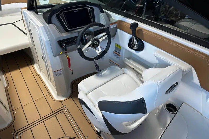 Slide: The Image of Interior of 2026 Chaparral 23 SSi with steering console and seat. - 7
