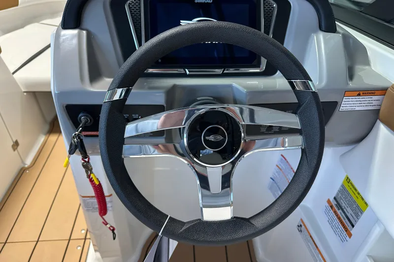 Slide: The Image of 2026 Chaparral 23 SSi steering wheel with modern display. - 9