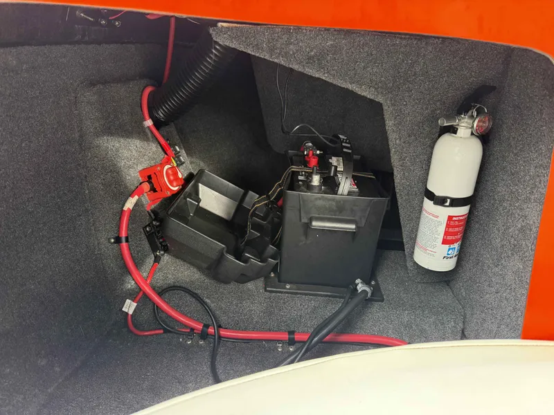 Slide: The Image of Battery and fire extinguisher in 2015 Moomba Outback V boat. - 13