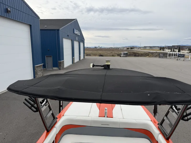 Slide: The Image of 2015 Moomba Outback V in front of blue marina building. - 15