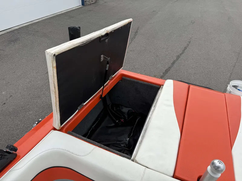 Slide: The Image of Open storage compartment of a 2015 Moomba Outback V boat. - 17