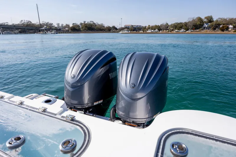 Slide: The Image of 2023 Sea Fox 288 Commander with dual Yamaha outboard engines on calm water. - 10