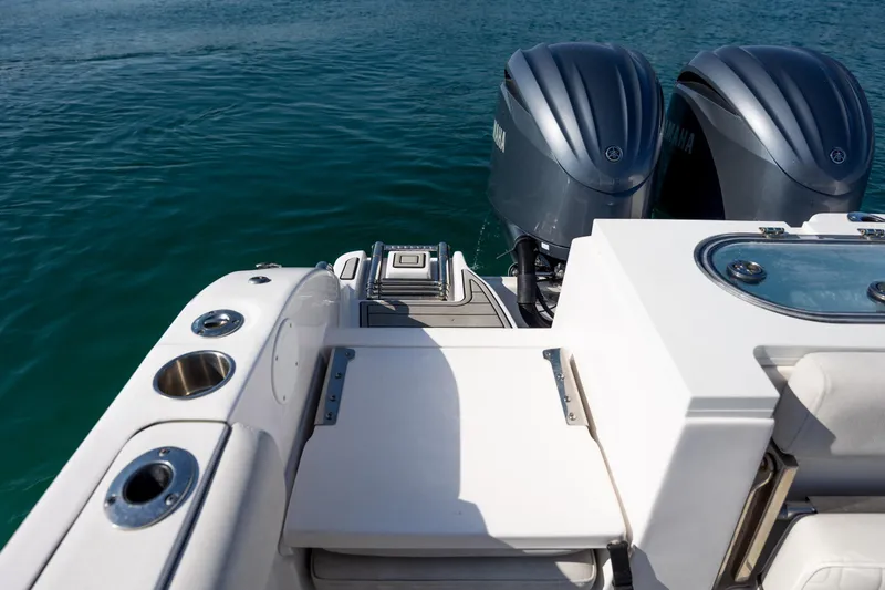 Slide: The Image of 2023 Sea Fox 288 Commander boat with dual Yamaha engines on clear water. - 11