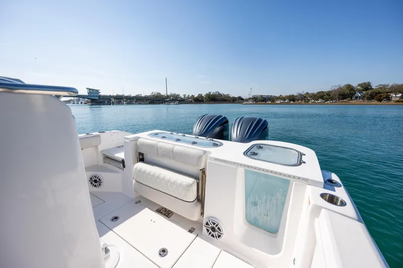 Slide: The Image of 2023 Sea Fox 288 Commander boat on calm water, featuring dual engines and spacious deck. - 15