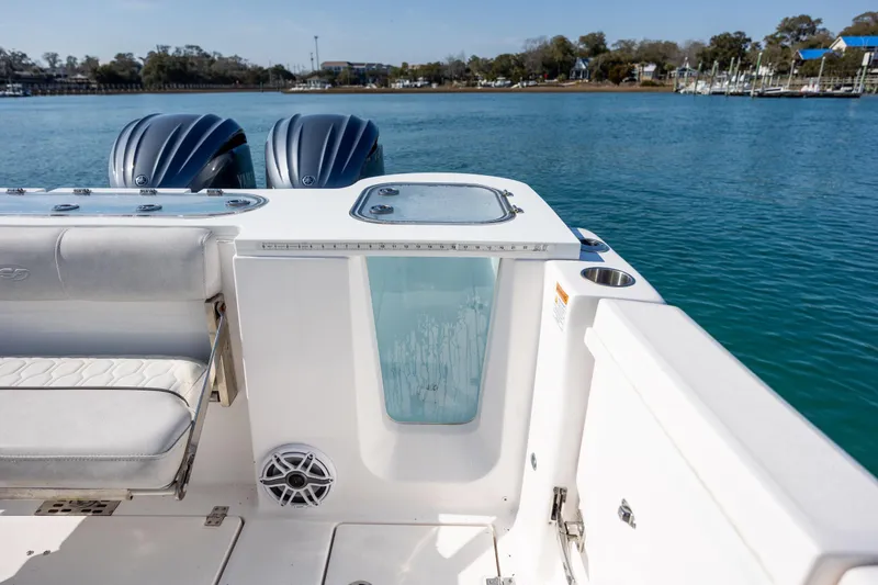 Slide: The Image of 2023 Sea Fox 288 Commander boat with dual engines on a serene waterway. - 17