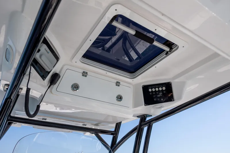 Slide: The Image of 2023 Sea Fox 288 Commander boat interior with control panel and hatch. - 23