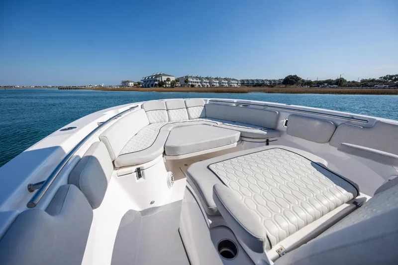 Slide: The Image of 2023 Sea Fox 288 Commander boat with luxurious seating on calm water. - 25