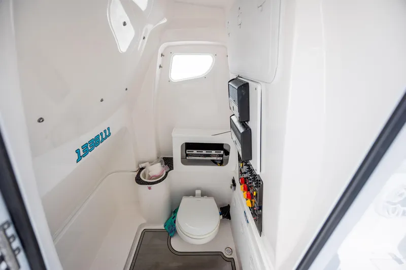 Slide: The Image of 2023 Sea Fox 288 Commander boat interior with toilet and control panel. - 30