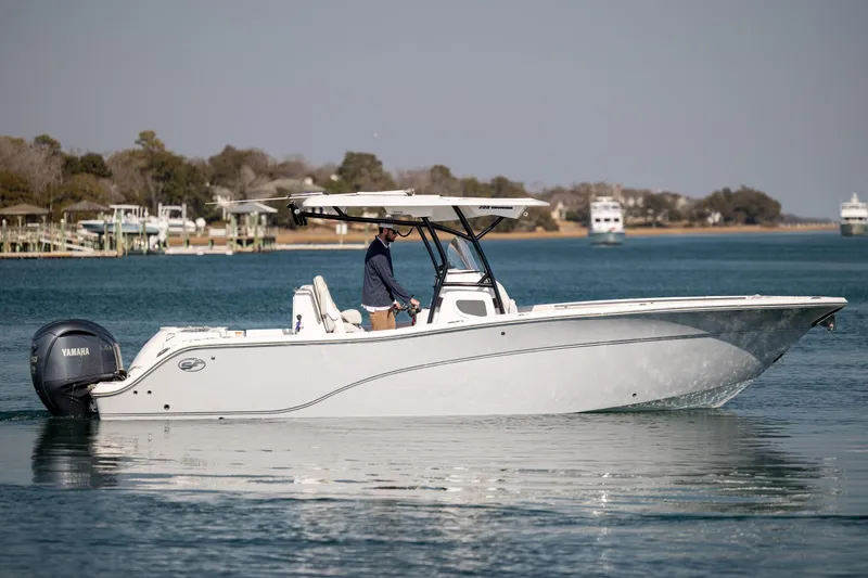 Slide: The Image of 2023 Sea Fox 288 Commander boat cruising on calm waters with scenic background. - 6