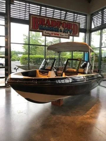 Slide: The Image of 2026 Ranger 1850MS boat displayed at Bradford Marine showroom. - 18