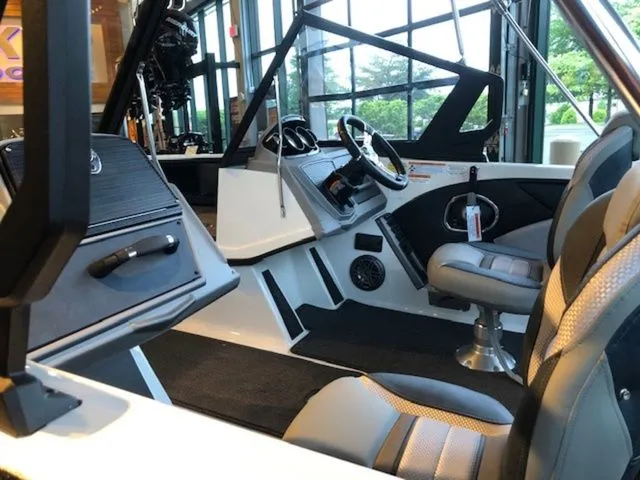 Slide: The Image of Interior of 2026 Ranger 1850MS boat with modern seats and steering console. - 24