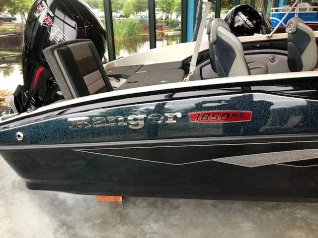 Slide: The Image of 2026 Ranger 1850MS boat displayed in a showroom. - 3