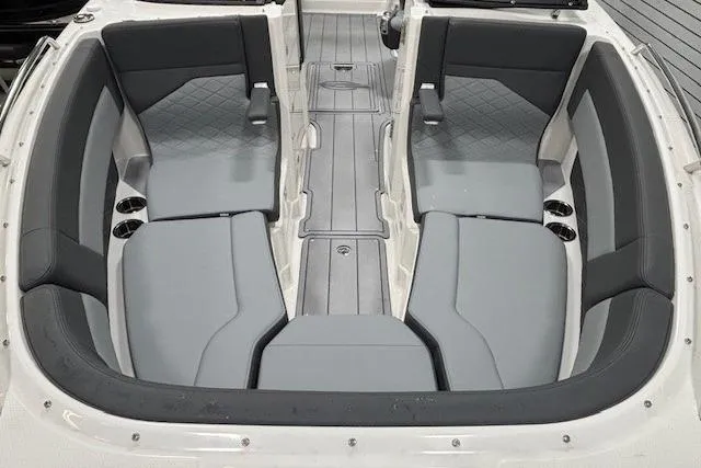 Slide: The Image of 2026 Chaparral SSX 8 boat interior with gray seating and modern design. - 10