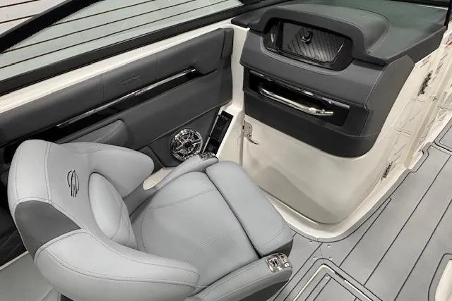 Slide: The Image of 2026 Chaparral SSX 8 boat interior with sleek gray seating and modern dashboard design. - 12