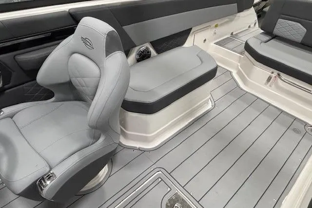Slide: The Image of Interior of 2026 Chaparral SSX 8 boat with gray seating and flooring. - 13