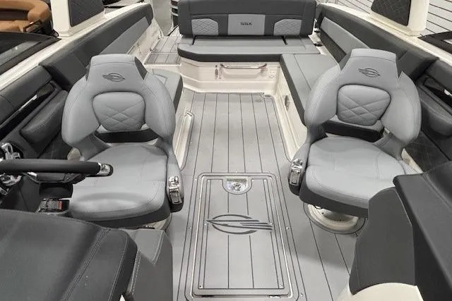 Slide: The Image of 2026 Chaparral SSX 8 boat interior with luxurious gray seating and modern design. - 15