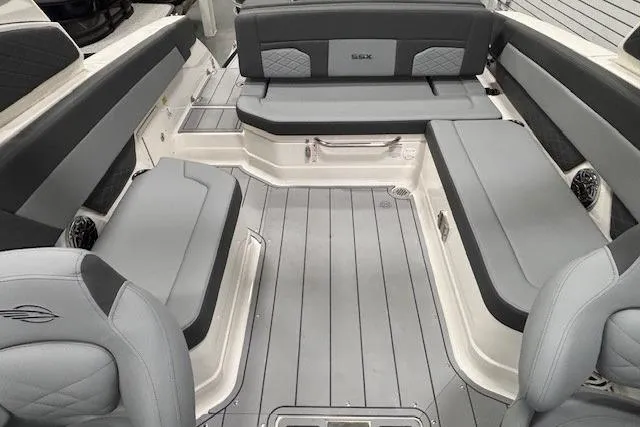 Slide: The Image of 2026 Chaparral SSX 8 boat interior with sleek gray seating and modern design. - 18