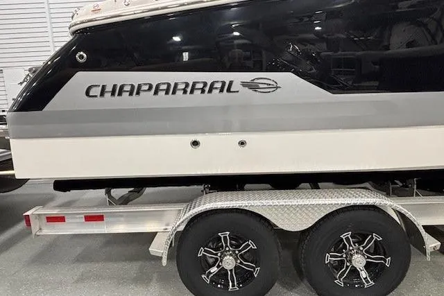 Slide: The Image of 2026 Chaparral SSX 8 boat on trailer, showcasing sleek design and branding. - 21
