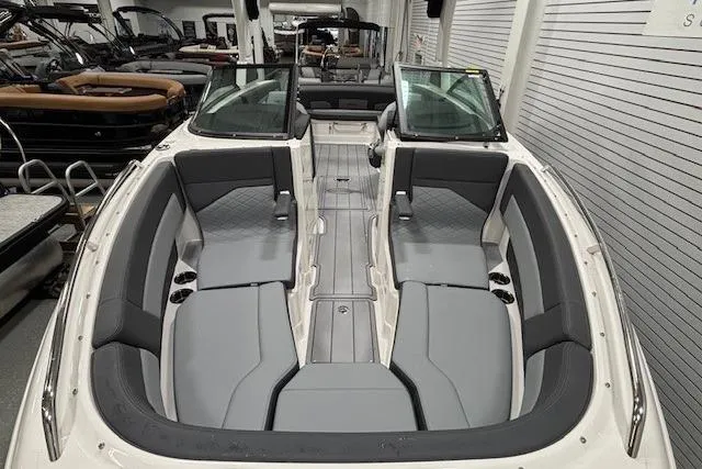 Slide: The Image of 2026 Chaparral SSX 8 boat interior with gray seating and open cockpit design. - 24