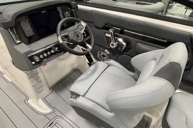 Slide: The Image of 2026 Chaparral SSX 8 boat cockpit with modern steering and controls. - 5