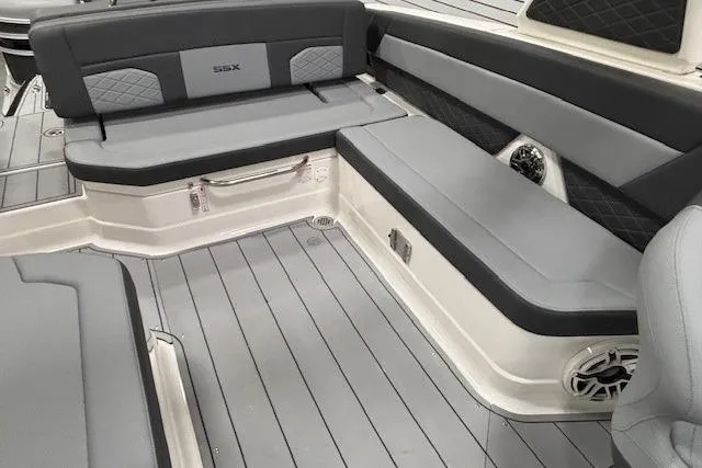 Slide: The Image of 2026 Chaparral SSX 8 boat interior with gray seating and sleek design. - 9