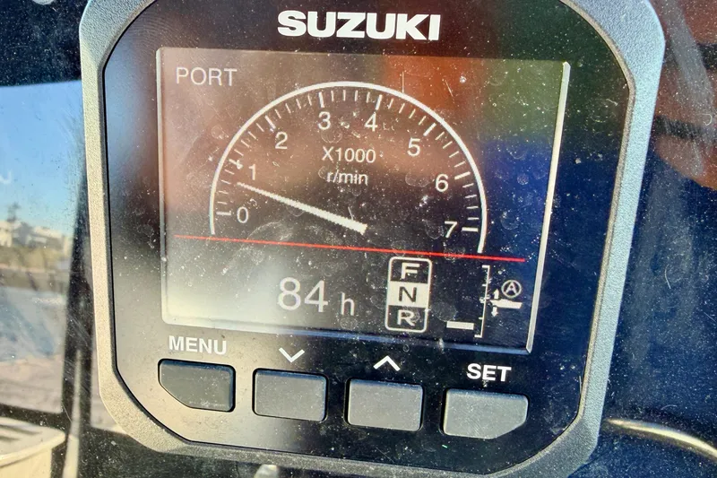 Slide: The Image of Suzuki boat gauge displaying 84 hours on Wellcraft 270 Coastal O/B, year 2000. - 14