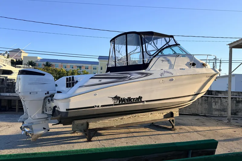 Slide: The Image of 2000 Wellcraft 270 Coastal O/B boat on display with Suzuki outboard engine. - 20