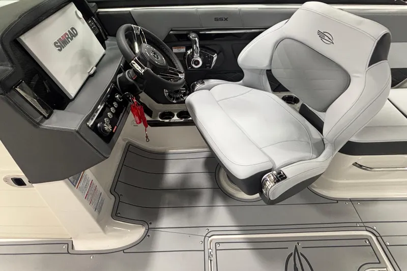 Slide: The Image of Interior of 2026 Chaparral SSX 30 boat with steering wheel and captain's seat. - 29