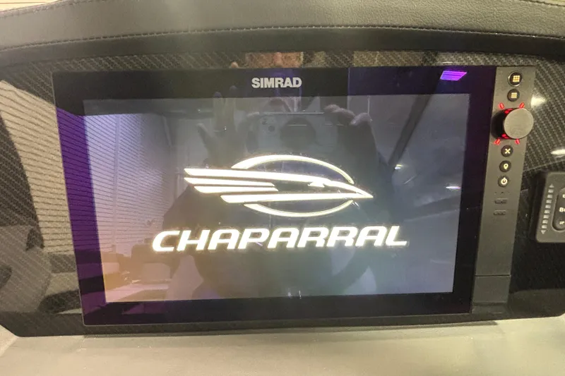 Slide: The Image of Simrad display showing Chaparral logo on 2026 Chaparral SSX 30 boat dashboard. - 30