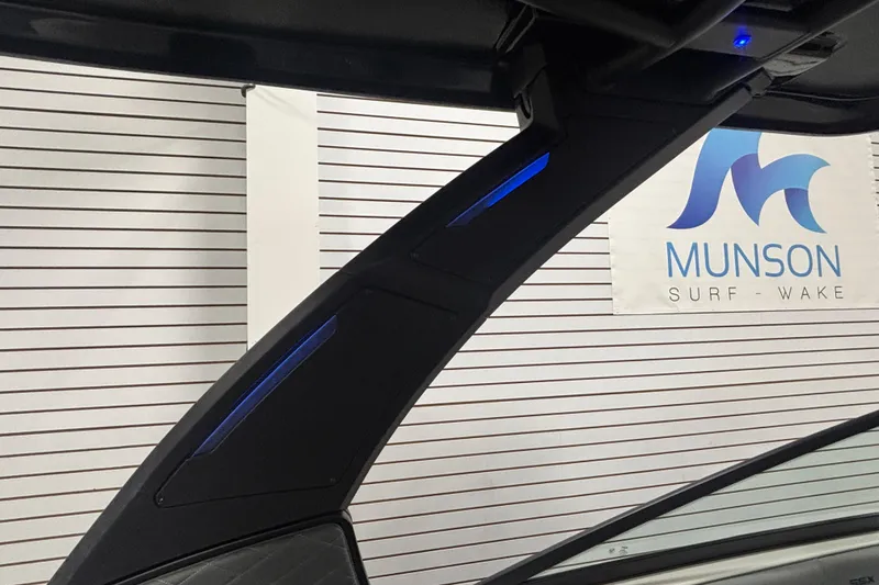 Slide: The Image of 2026 Chaparral SSX 30 boat interior with sleek design and blue LED lighting. - 35