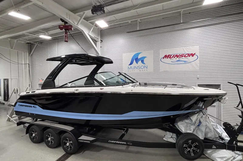 Slide: The Image of 2026 Chaparral SSX 30 boat on trailer in showroom, Munson Ski & Marine. - 11