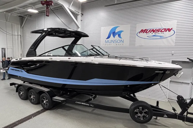 Slide: The Image of 2026 Chaparral SSX 30 boat on trailer in showroom, Munson Ski & Marine. - 15
