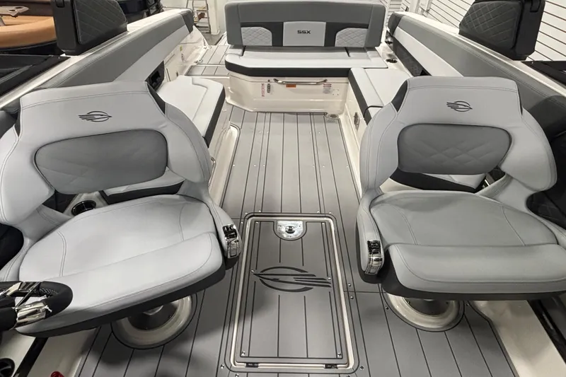 Slide: The Image of 2026 Chaparral SSX 30 boat interior with sleek gray seating and modern design. - 26